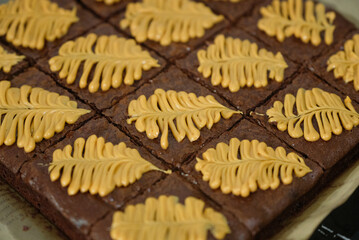 Homemade pieces of brownies on black table