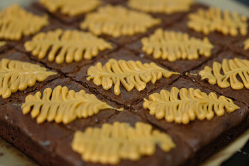 Homemade pieces of brownies on black table
