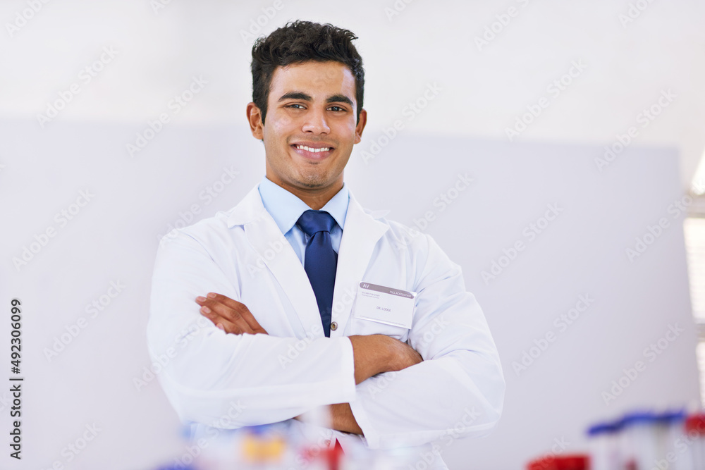 Poster science is its own satisfaction. portrait of a smiling lab technician standing in a laboratory.