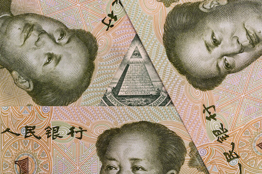 1 American dollar bill and a 1 Chinese yuan bills