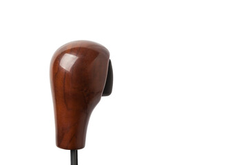 Wooden handle for shifting automatic gears of the car. Decorative details on a black background