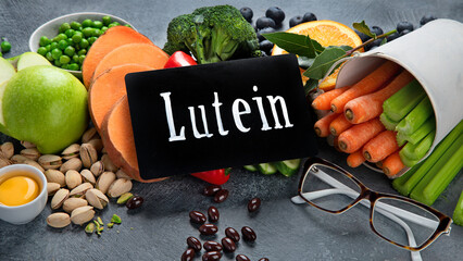 Foods high in lutein on dark background.