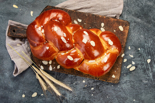 Easter sweet bread, tsoureki cozonac on dark background.