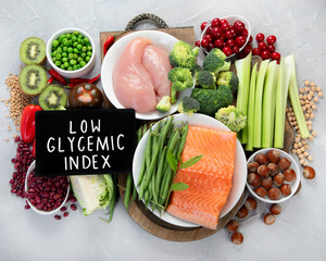 Foods with low glycemic index on gray background. - obrazy, fototapety, plakaty