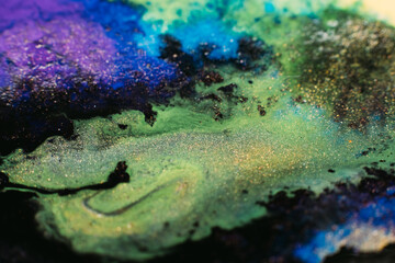 Fluid inks. Multicolor artistic background. Purple green paints mix