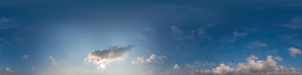 Blue sky panorama with Cirrus clouds in Seamless spherical equirectangular format. Full zenith for use in 3D graphics, game and editing aerial drone 360 degree panoramas for sky replacement.