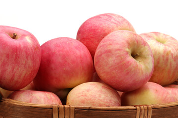 Apples in a basket on a white background.