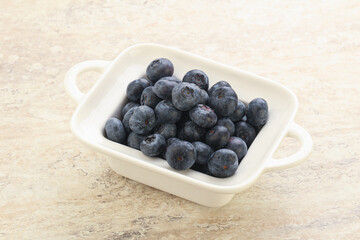 Sweet ripe blueberry heap in the bowl
