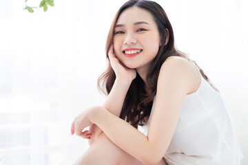 Image of beautiful young Asian woman in the morning
