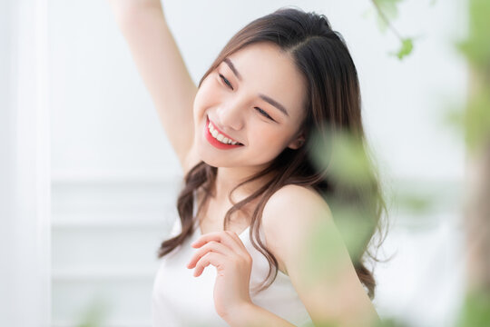 Image of beautiful young Asian woman in the morning