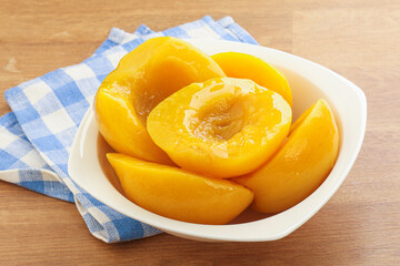 Sweet canned peaches with syrope