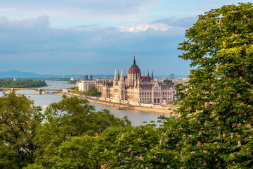 Budapest parliament building with green foliage