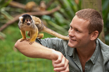 Tarzan loved spending time with his little friend. Shot of a young man interacting with a little...