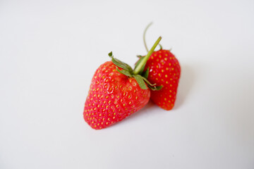 Bright red strawberries on a white background.