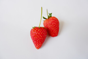 Bright red strawberries on a white background.