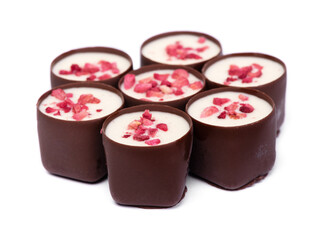 Heap of chocolate glazed sweets with fruit pieces