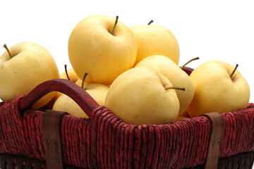 Close view of some tasty yellow apples isolated on a white background