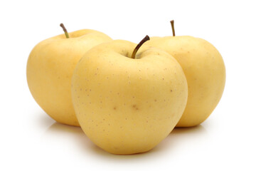 Close view of some tasty yellow apples isolated on a white background