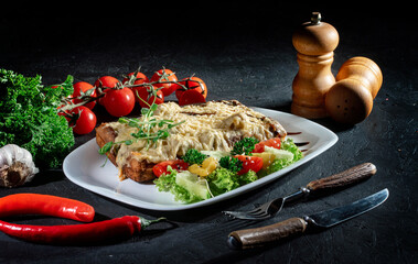 Delicious, fit and helathy breakfast idea. Delicious belgian waffles with egg, cheese and vegetables on dark background