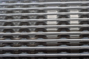 shiny metal corrugation. bent aluminum foil lamella.