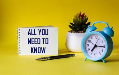 Everything you need to know. Motivation quote on notepad and yellow background