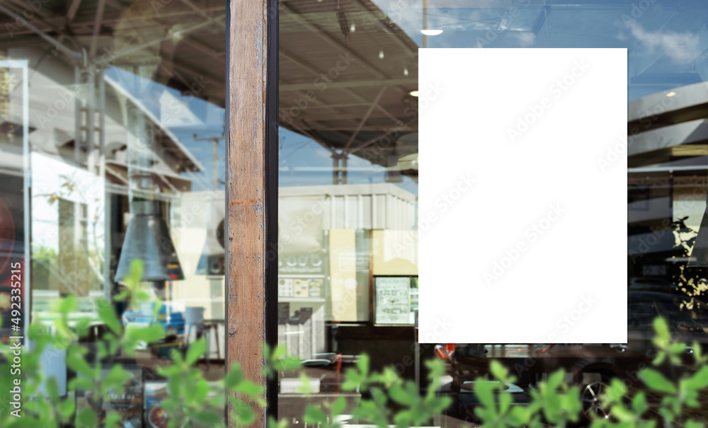 Wall mural mockup white paper or white sticker poster displayed on the front of the restaurant, coffee shop, pr