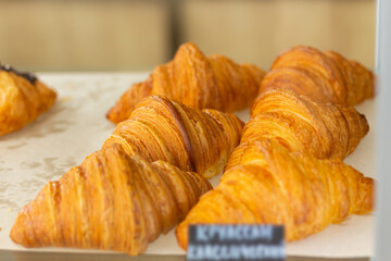 Croissant baked on shelf at French bakery cafe,