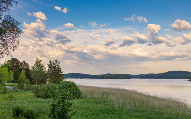 Panoramic landscape with evening lake. Nature conceptual image. Evening on the lake at summer. vintage picture.