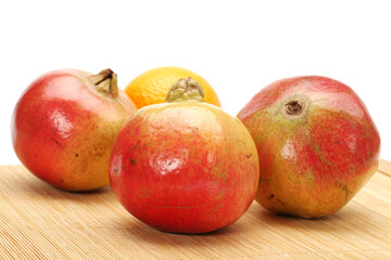Ripe pomegranate fruit isolated on white background