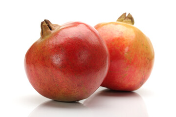 Ripe pomegranate fruit isolated on white background