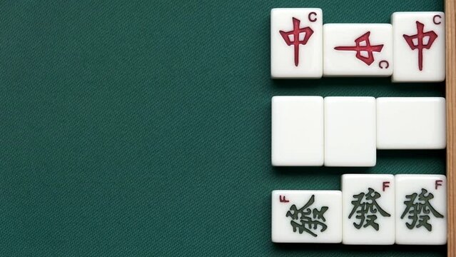 Mahjong game. Three pones on dragons. Red chun , green,white dragon. Daisangen yakuman.