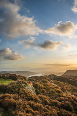 Majestic Autumn sunset landscape image from Holme Fell looking towards Coniston Water in Lake District