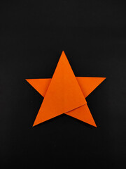Colorful stars made of origami paper isolated on black background, Not Focus