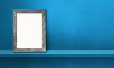 Wooden picture frame leaning on a blue shelf. 3d illustration. Horizontal banner