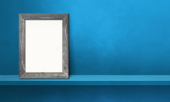 Wooden picture frame leaning on a blue shelf. 3d illustration. Horizontal banner