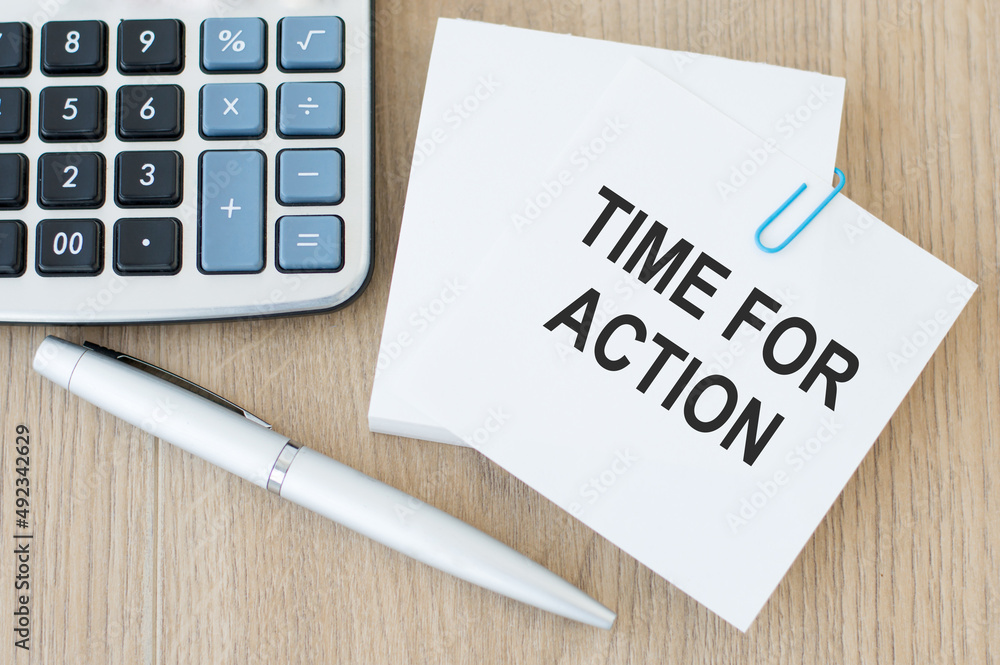 Poster a white card with time for action text on a wooden table, a row of a calculator and a pen