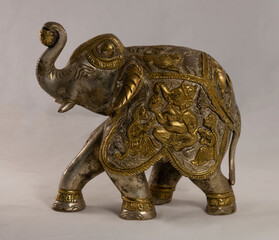 Figurine of an Indian elephant made of bronze on a white background