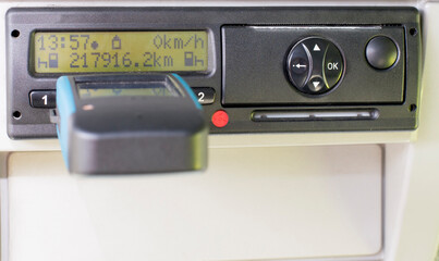 Digital tachograph reader plugged in a Tachograph download. Tachograph download, control, check.