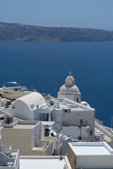 Fototapeta na wymiar Wonderful view of the famous village of Fira in Santorini and the blue Aegean Sea
