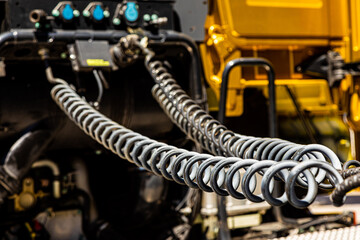 spiral hose pipes on the rear of a semi truck tractor