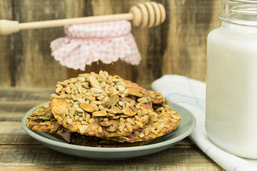 Fresh cookies with milk on a wooden table