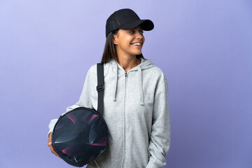 Young sport woman with sport bag looking to the side and smiling