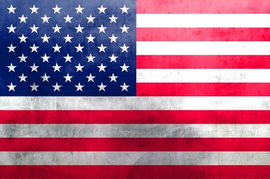 Vintage image of the national flag of USA on a metal surface. Background.
