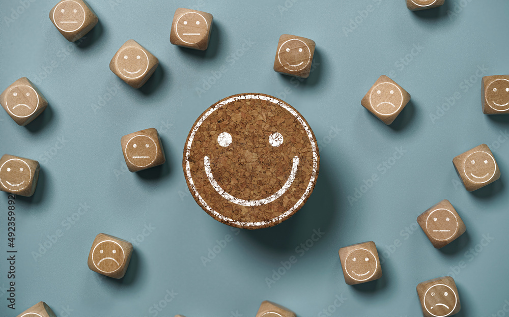Poster Smile face print screen on round  wooden block with golden five stars for client customer satisfaction after use product and service concept.