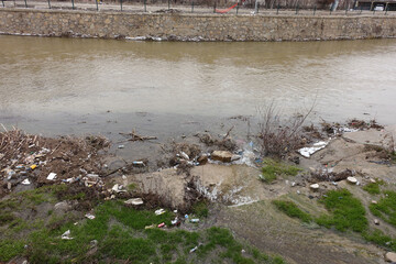 Fototapeta premium pollution of natural rivers by humans, river polluted by urban waste,