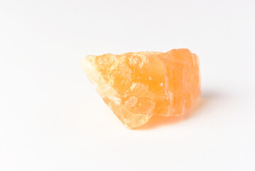 corundum stone  on a white background. yellow.