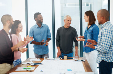 Fototapeta premium Working together to design your dreams. Cropped shot of a group of architects in the boardroom.