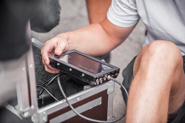 Behind the scenes. Cameraman checks and playback the recorded material