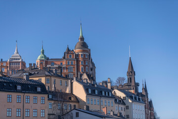 Fototapeta premium Old houses in shadow at the block Bastugatan in the district Södermalm a sunny winter day in Stockholm