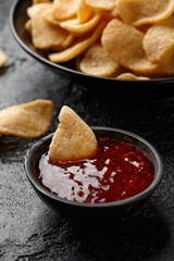 Crispy Prawn Crackers in black bowl with sweet chilli sauce
